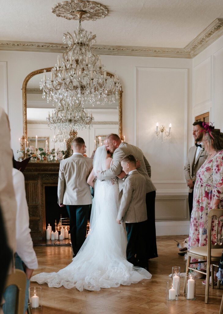 Luxury wedding ceremony photography Scotland indoor ceremony elegant chandelier venue