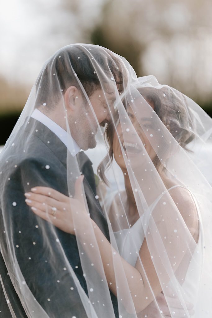 Editorial wedding photography Scotland romantic couple portrait under veil