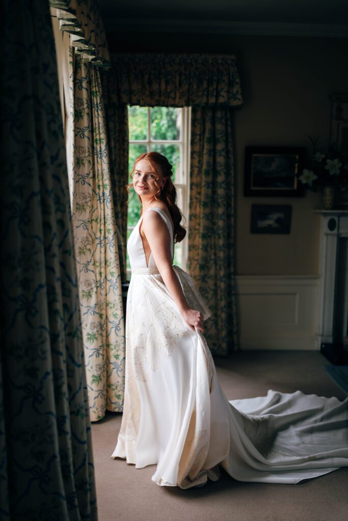 Editorial Bridal portrait photography Scotland bride standing by window light