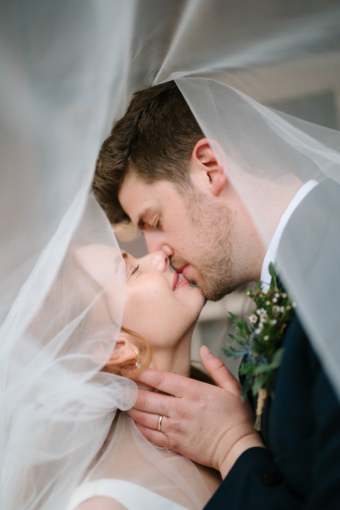 Luxury wedding photography Scotland couple portrait under veil