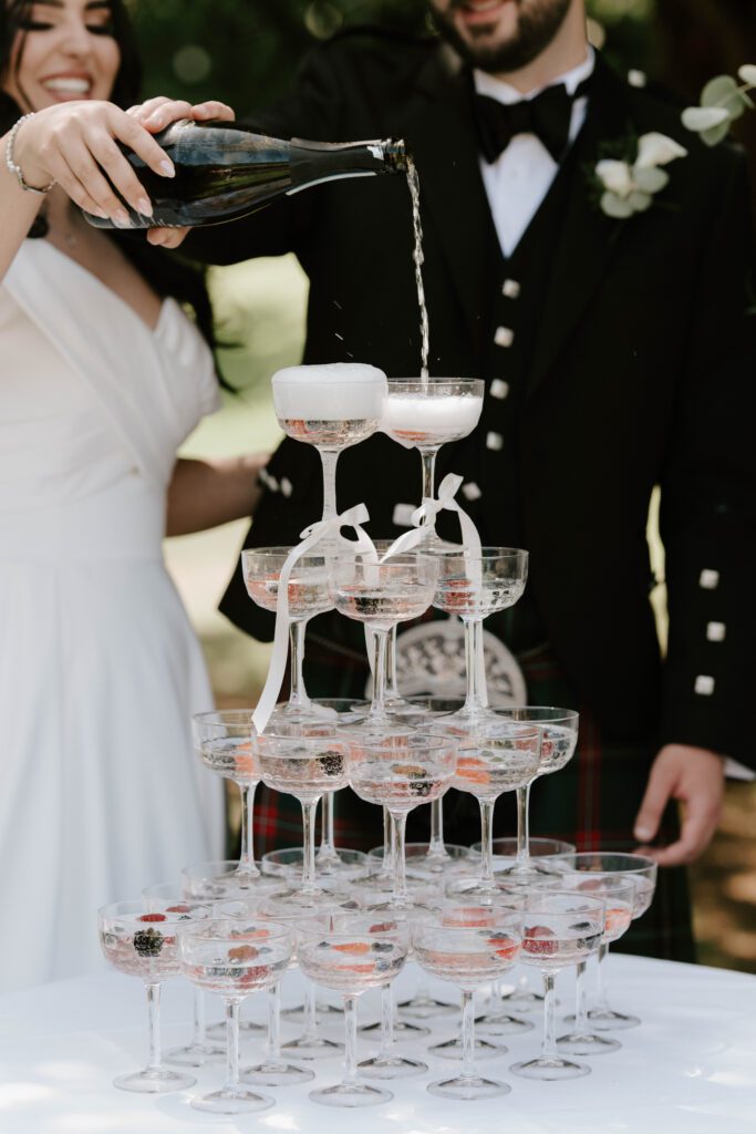 Luxury wedding reception photography Scotland champagne tower celebration detail