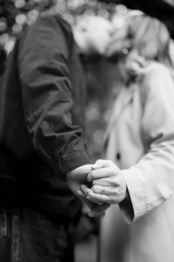 couple embracing each other in black and white. Countryside backdrops and intimate connection captured in an editorial, timeless photography style.